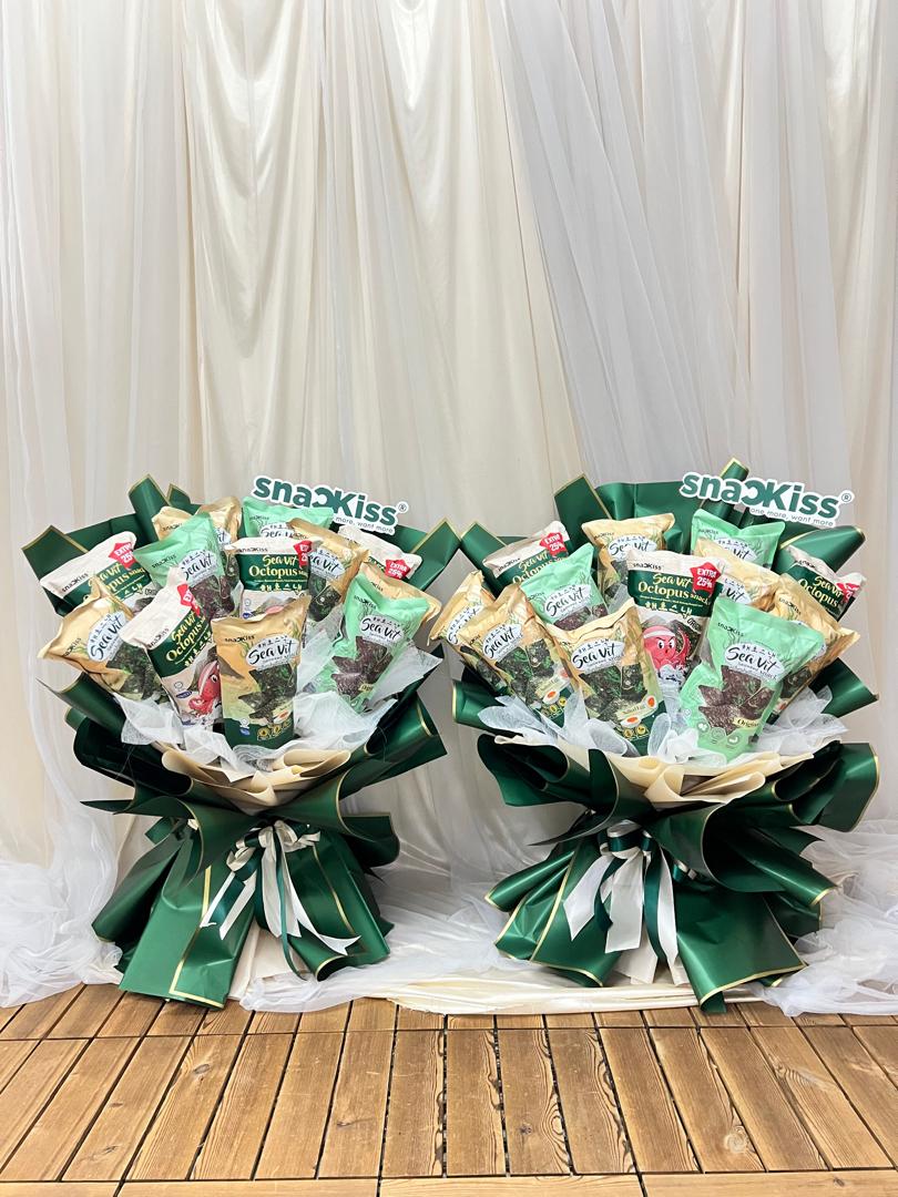 Two green wrapped snack bouquets filled with seaweed packets